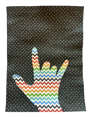 A hand silhouette making the American Sign Language sign for "I love you" against a black background with small turquoise polka dots. Hand is filled with colorful zigzag stripes in red, orange, yellow, green, blue, and black, creating a vibrant contrast with the background.